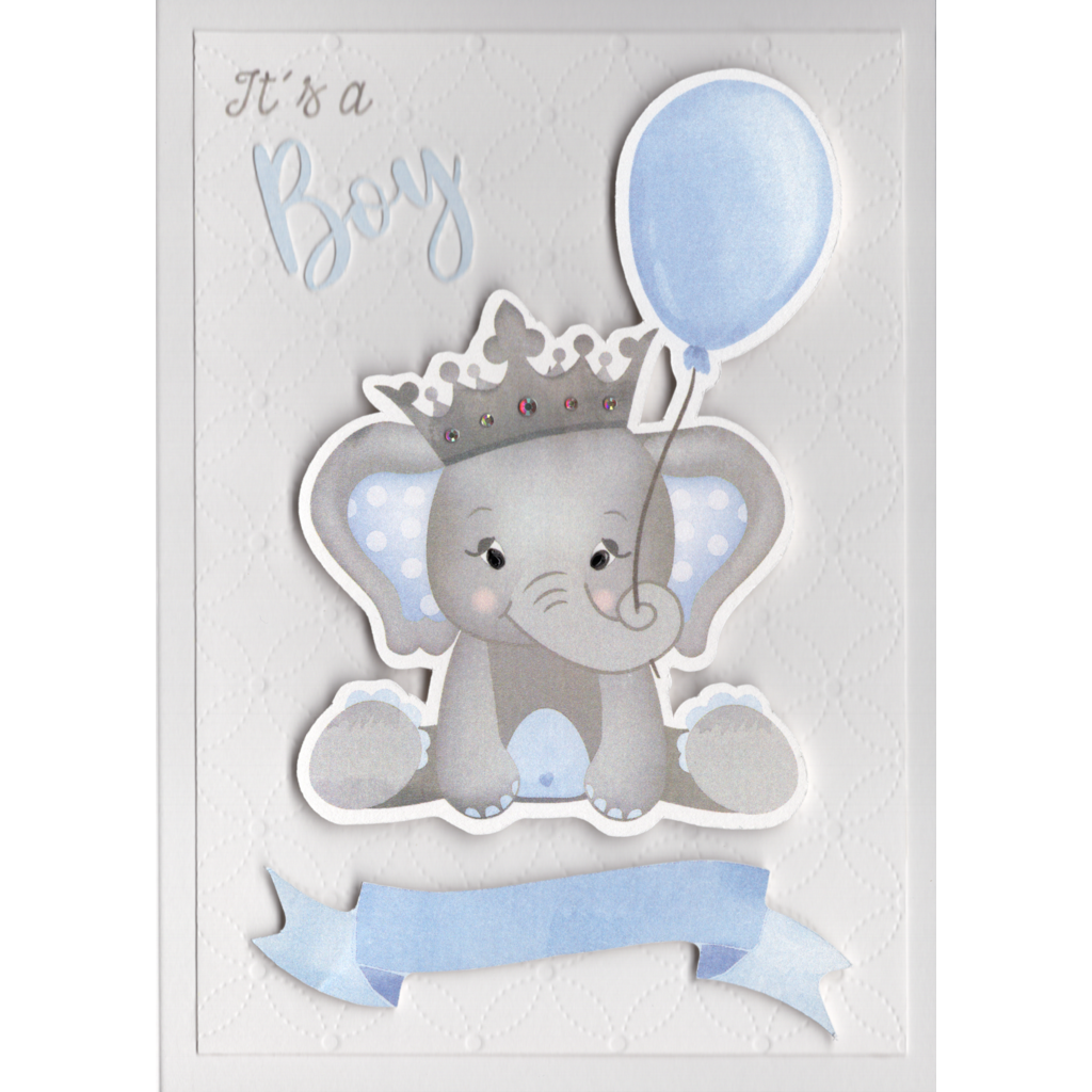 A pale grey card with a cute baby elephant image raised up from card. He has large ears lined with blue with white polka dots. Shiny black eyes and a pewter crown embellished with crystals sits on his head. He is holding a blue balloon with his trunk. There is a banner at the elephants feet where a name or message can be written. The words "It&