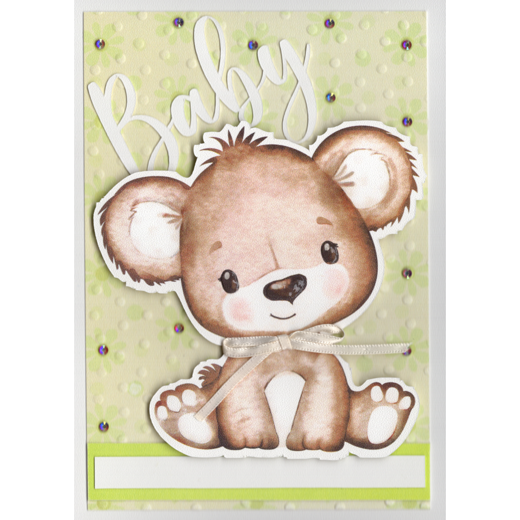 Cute pale brown shading to white baby bear on a pale green embossed polka dot background. Flowers are scattered over the card front with jewels at their centres. The bear has glossy eyes, nose and a cream ribbon bow around his neck. The word Baby is raised up from the card surface and is in white cardstock. The bear stands out proudly from the card surface. There is a white panel for the recipients name to be written on.