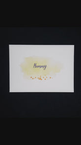This is a video showing the envelope being opened, the card being removed. It shows the card being opened to show the inside pages and the back page. It highlights the jewels and the movable tag. It also shows the beautiful lustre of the cardstock.