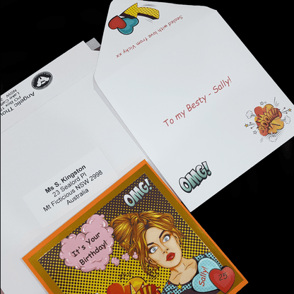 Front of customised card, and open envelope lying on addressed rigid mailer