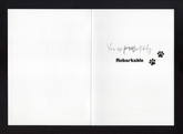 An open card with the words "You are pawsitively rebarkable" and two paw prints 