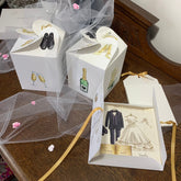 square parchment book wedding card in folder with pair of matching candle